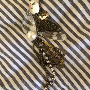Goldtone necklace with metal leaves, crystals